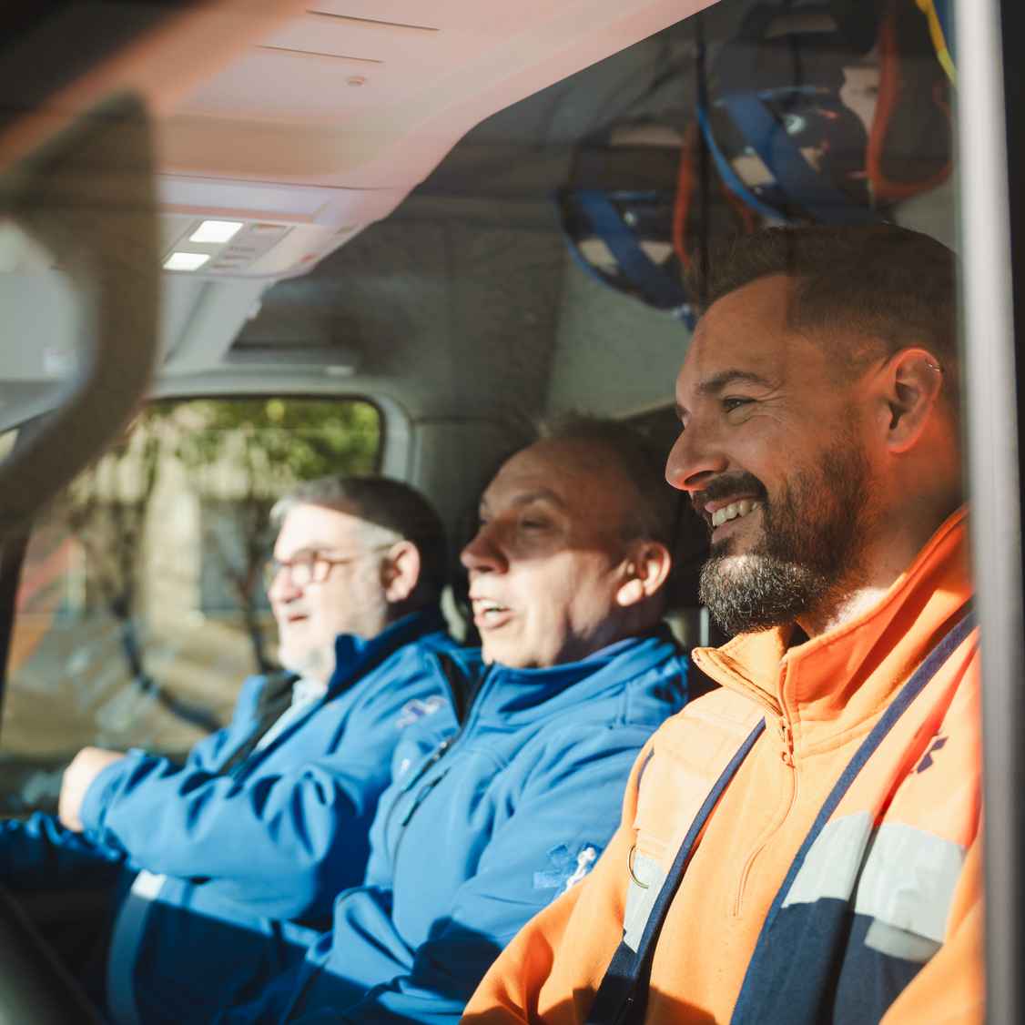 happy co workers driving